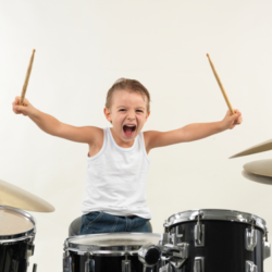 kid-playing-drums kid-playing-drums