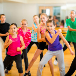 Dance fitness Group of children participating in dance fitness class.